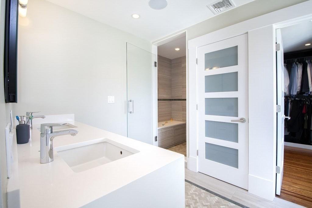 43 Surfside Road Scituate, MA 02066 - Photo 21 of 40 a bathroom with a sink and a mirror