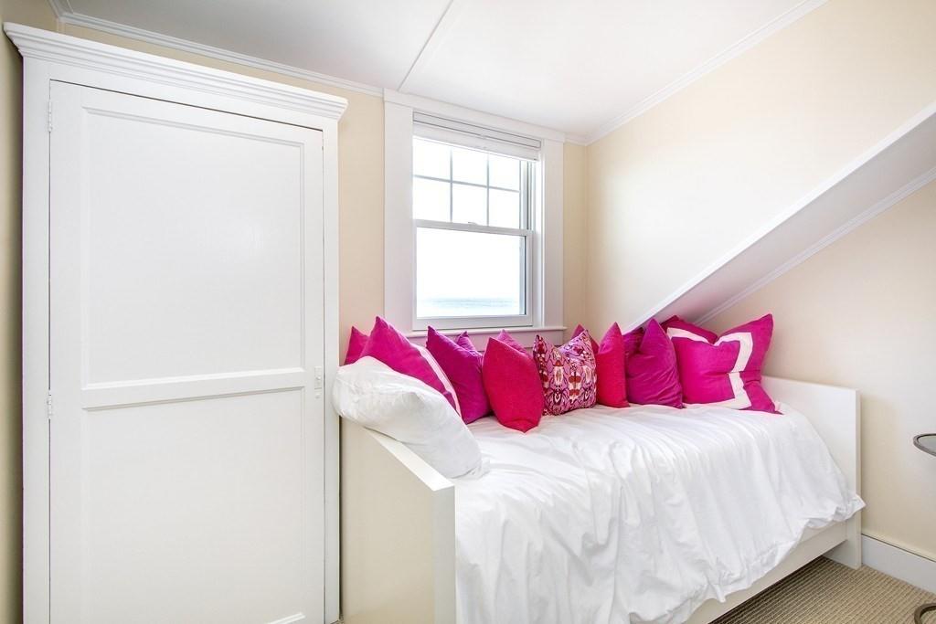 43 Surfside Road Scituate, MA 02066 - Photo 26 of 40 a bed sitting in a bedroom next to a window