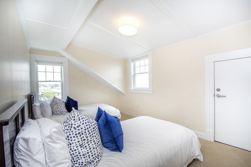 43 Surfside Road Scituate, MA 02066 - Photo 27 of 40 a bedroom with a bed and a window