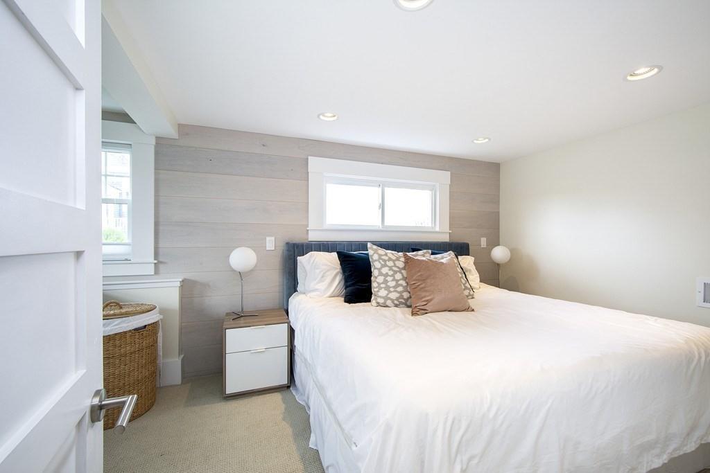 43 Surfside Road Scituate, MA 02066 - Photo 30 of 40 a bedroom with a bed and a lamp