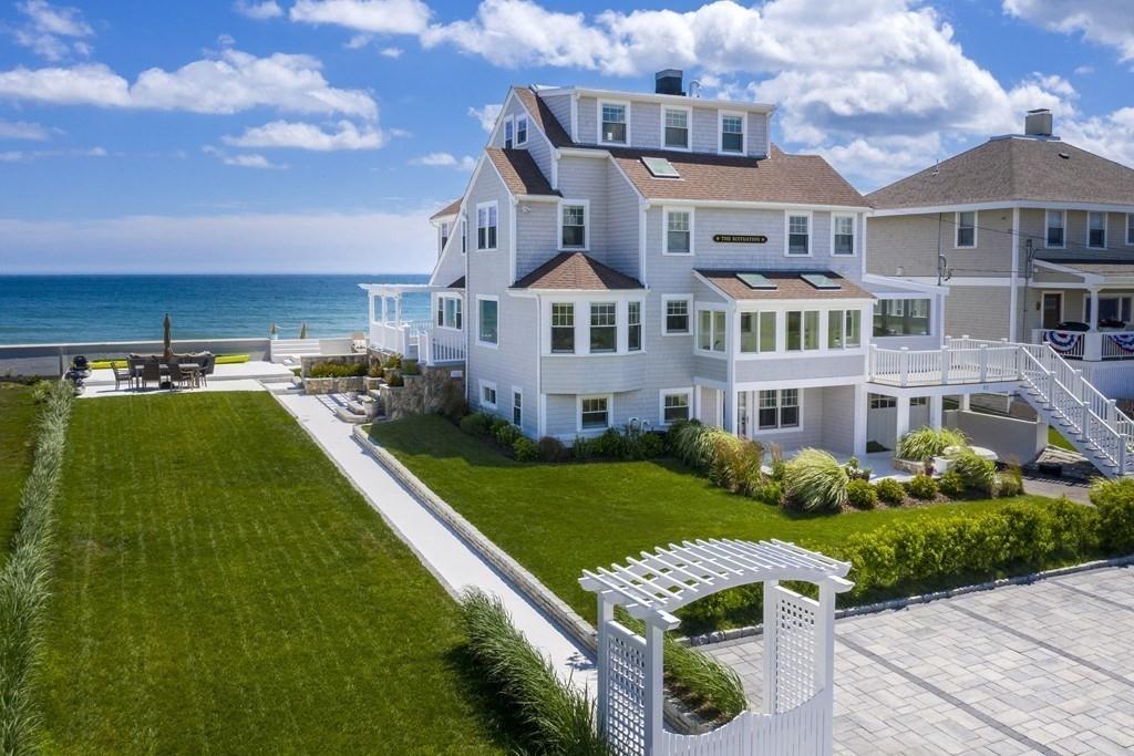 43 Surfside Road Scituate, MA 02066 - Photo 3 of 40 a front view of a house with a garden and plants
