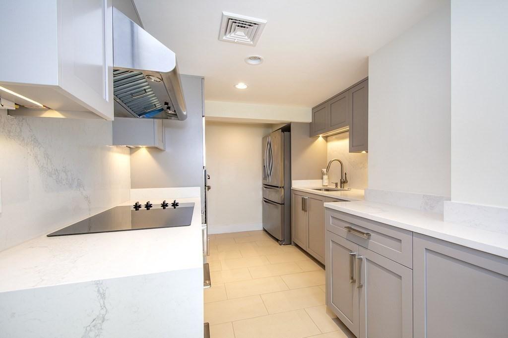 43 Surfside Road Scituate, MA 02066 - Photo 31 of 40 a bathroom with a sink and a mirror