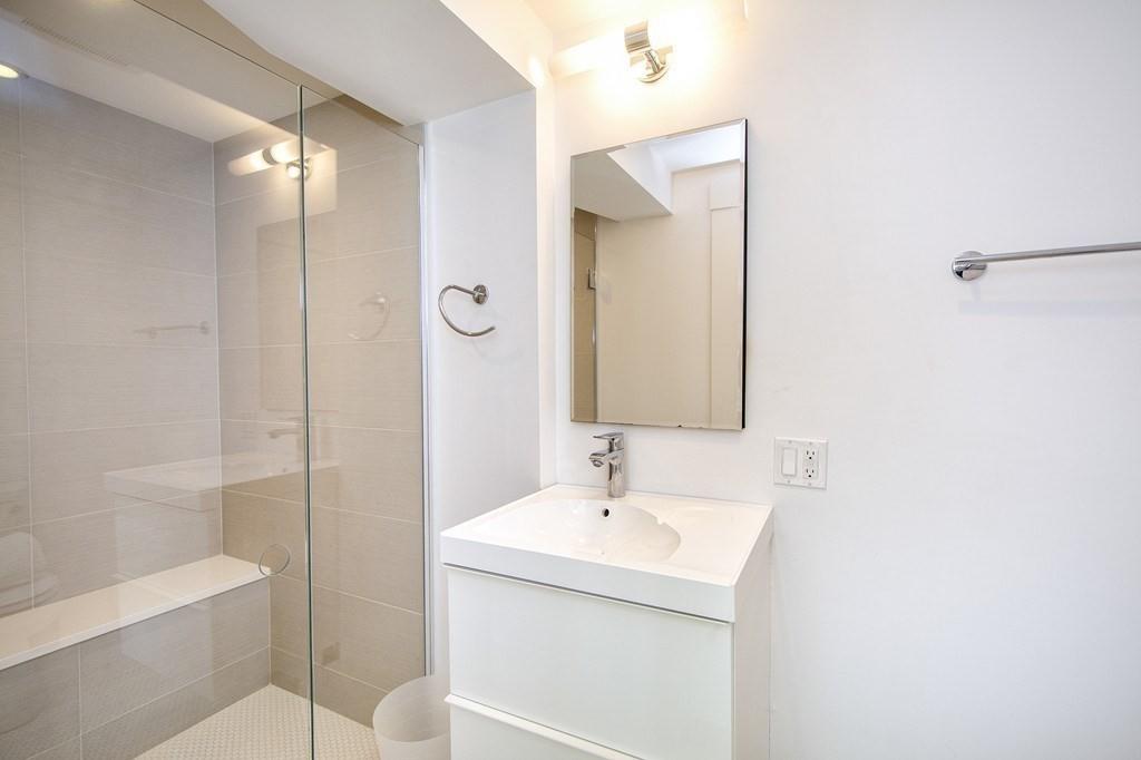 43 Surfside Road Scituate, MA 02066 - Photo 33 of 40 a bathroom with a sink a toilet and shower