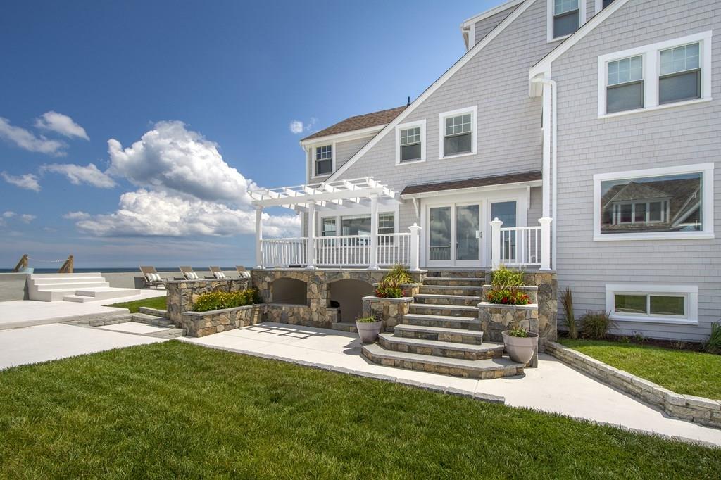 43 Surfside Road Scituate, MA 02066 - Photo 37 of 40 a front view of a house with a yard table and chairs