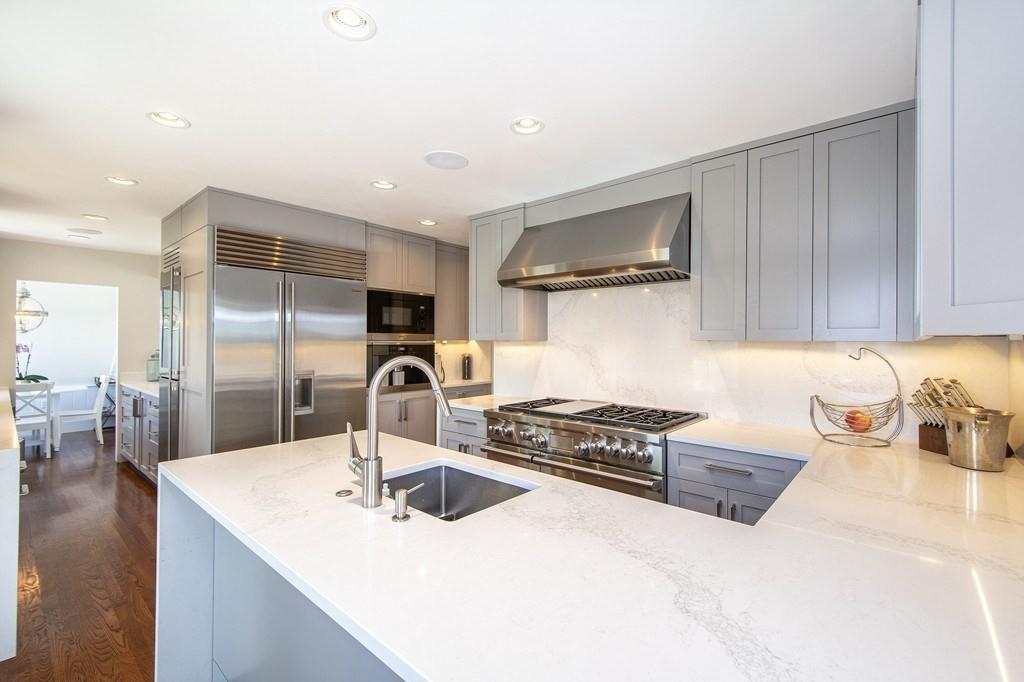 43 Surfside Road Scituate, MA 02066 - Photo 10 of 40 a kitchen with granite countertop a sink a stove and refrigerator