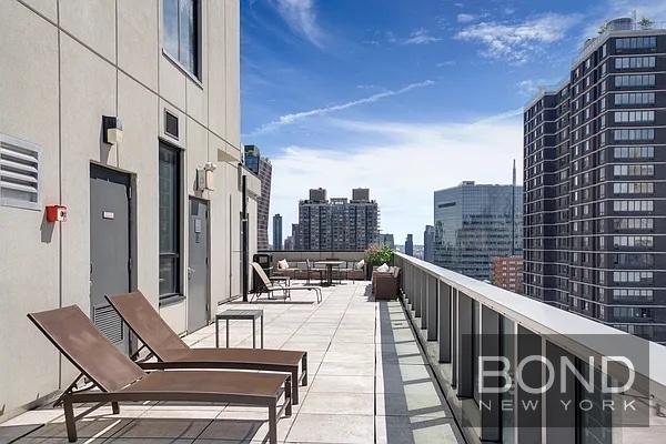 237 East 34th Street, Unit 706 Manhattan, NY 10016 - Photo 13 of 25 a view of balcony with outdoor seating and city view