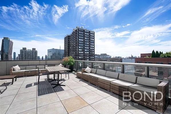 237 East 34th Street, Unit 706 Manhattan, NY 10016 - Photo 14 of 25 a roof deck with couches and potted plants