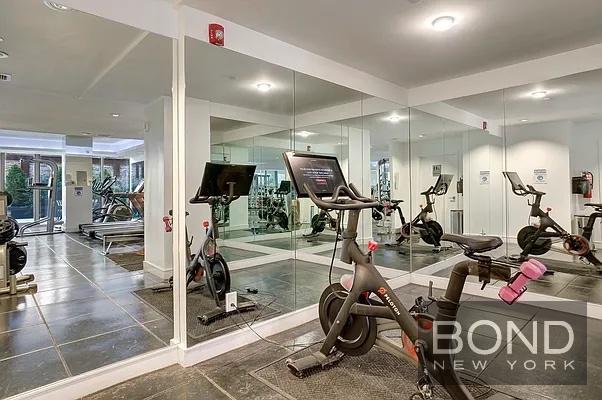 237 East 34th Street, Unit 706 Manhattan, NY 10016 - Photo 15 of 25 a view of a room with gym equipment