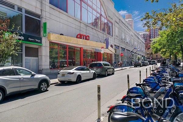 237 East 34th Street, Unit 706 Manhattan, NY 10016 - Photo 24 of 25 a view of a cars park in front of a building