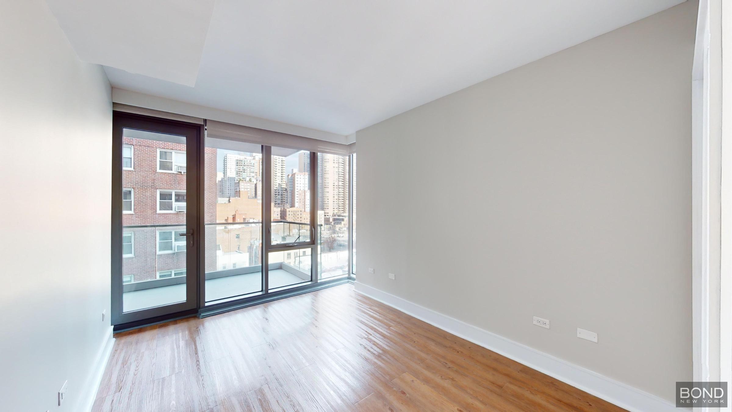 237 East 34th Street, Unit 706 Manhattan, NY 10016 - Photo 7 of 25 wooden floor in an empty room with a window
