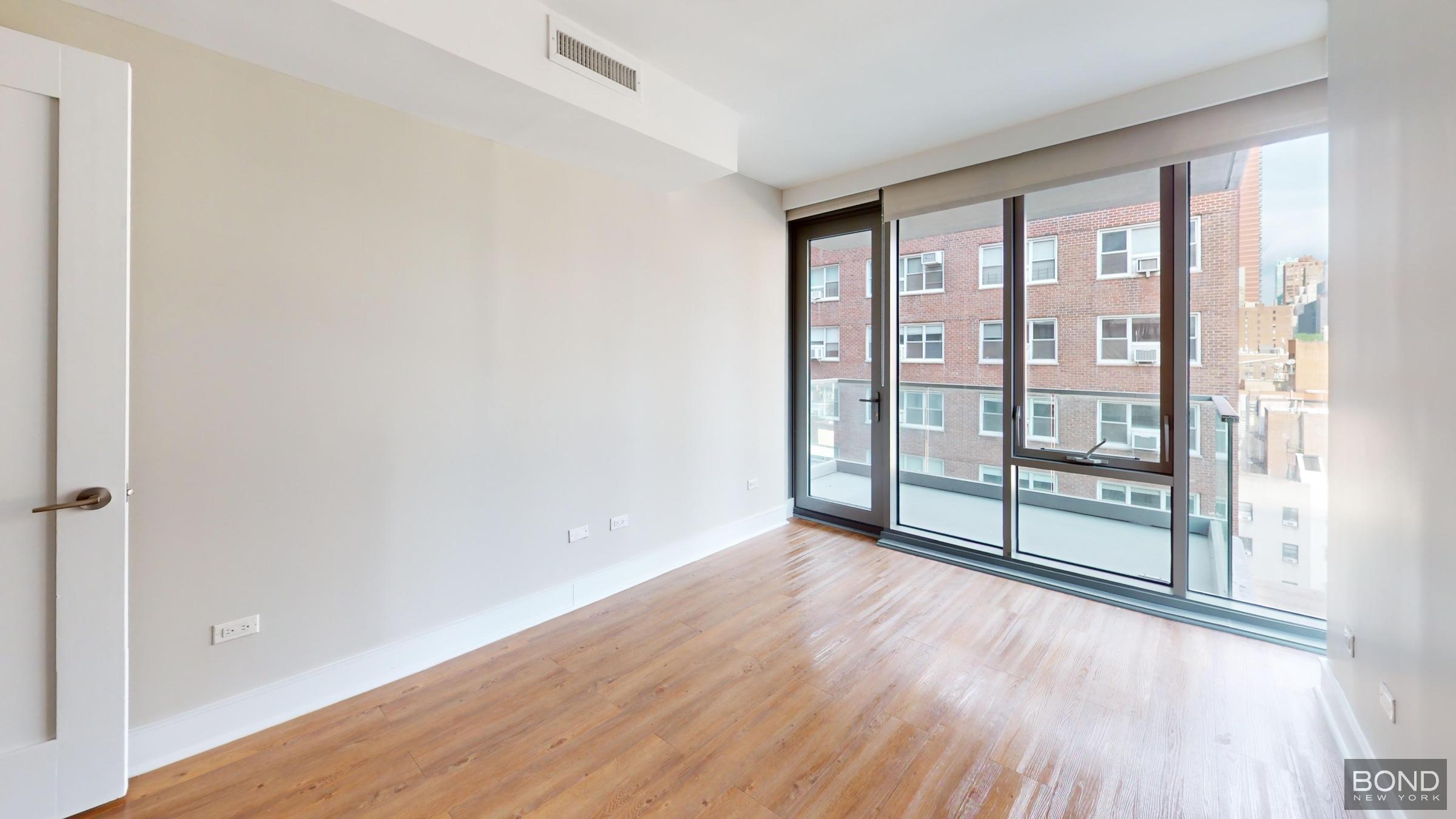 237 East 34th Street, Unit 706 Manhattan, NY 10016 - Photo 8 of 25 wooden floor in an empty room with a window