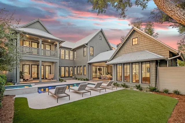 a front view of house with a garden and patio