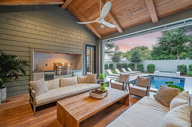 a kitchen with stainless steel appliances granite countertop a sink and a wooden floors