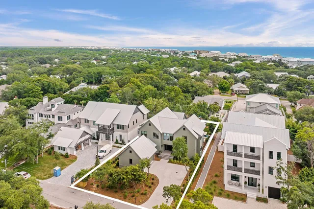 a kitchen with a table chairs sink and cabinets