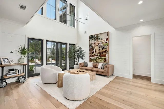 a kitchen with stainless steel appliances granite countertop a sink and a refrigerator
