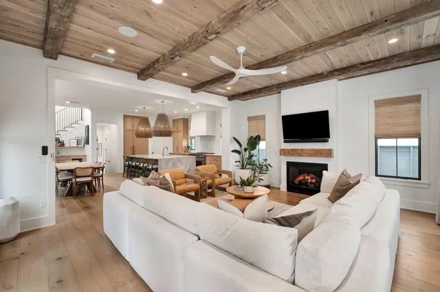 a kitchen with white cabinets and a stove
