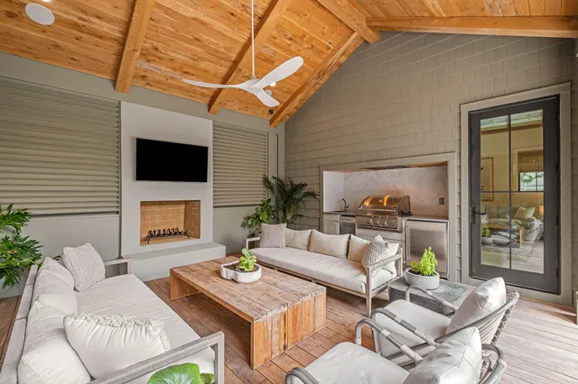 a en suite bathroom with a granite countertop sink and a mirror