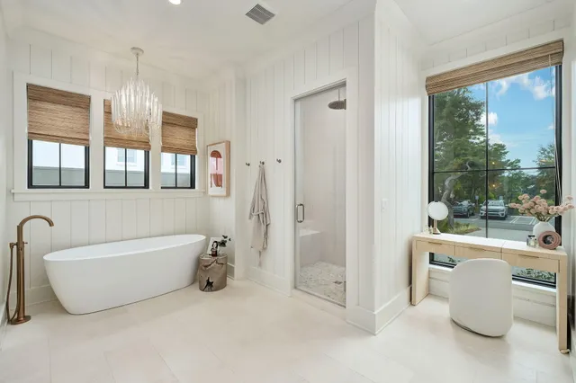 a bathroom with a bathtub and shower