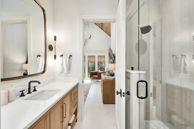 a bathroom with 2 sink tub and a mirror