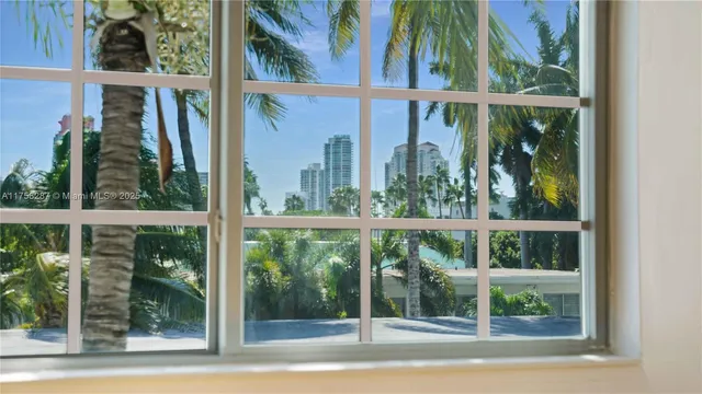 a view of a house with a windows and tree outside