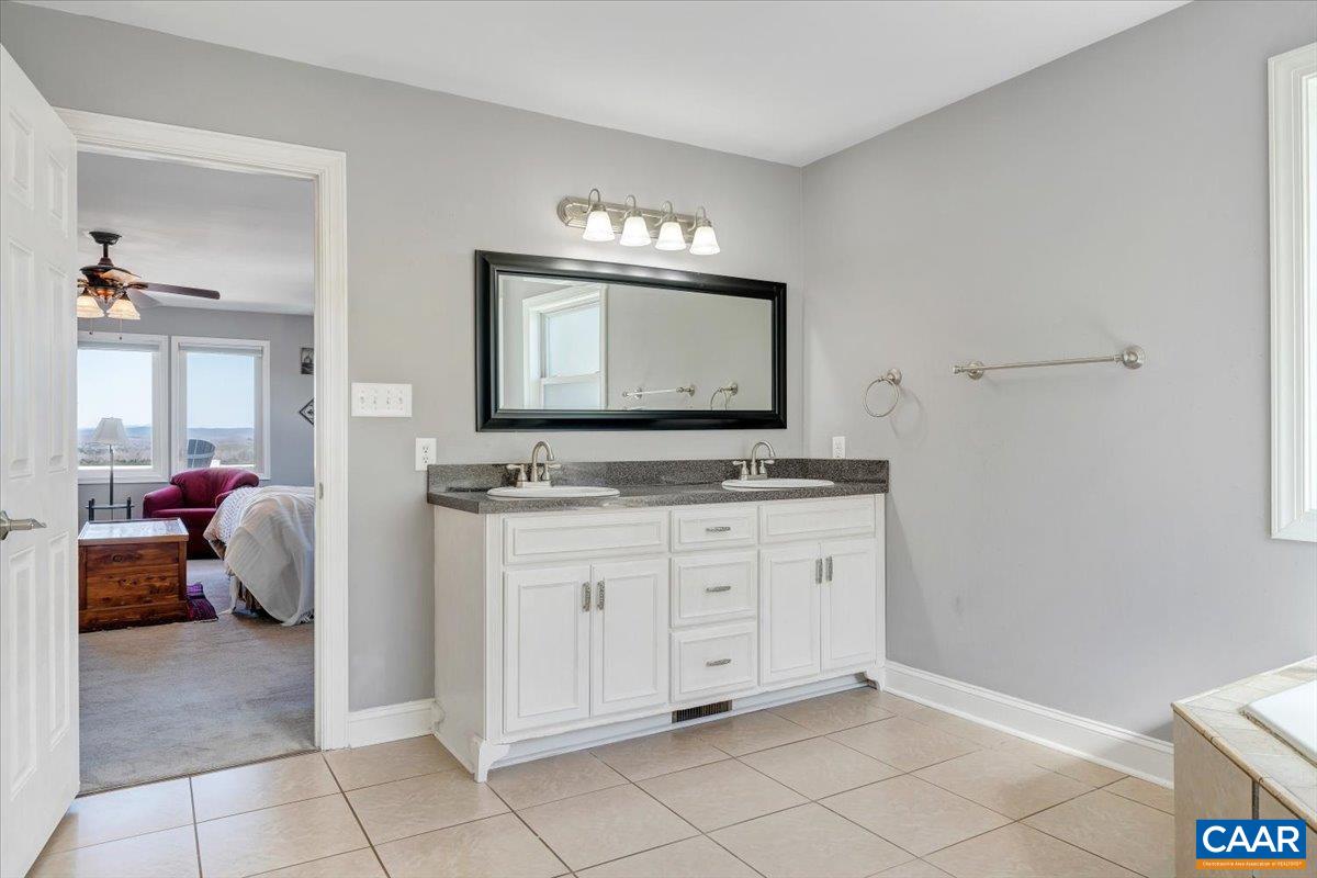 439 Gardner Farm Road Appomattox, VA 24522 - Photo 31 of 73 a spacious bathroom with a sink and a mirror