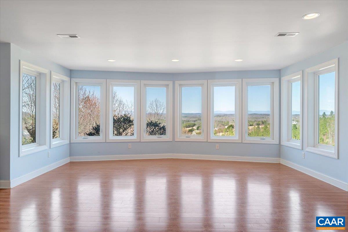 439 Gardner Farm Road Appomattox, VA 24522 - Photo 42 of 73 an empty room with wooden floor and windows
