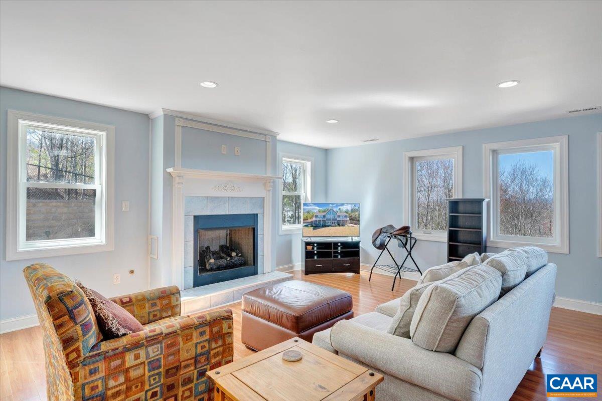439 Gardner Farm Road Appomattox, VA 24522 - Photo 47 of 73 a living room with furniture a fireplace and a window