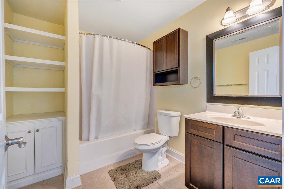 439 Gardner Farm Road Appomattox, VA 24522 - Photo 51 of 73 a bathroom with a sink a toilet and shower