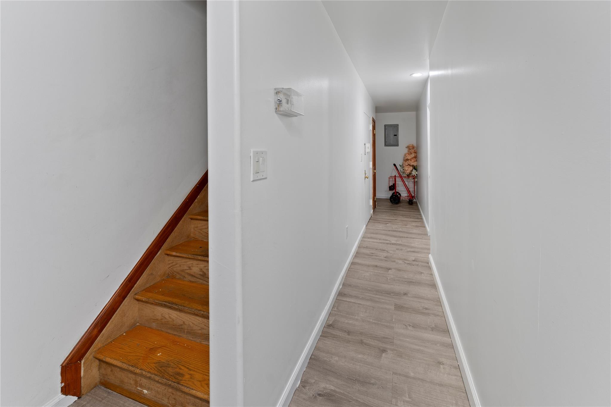 848 Morris Park Avenue Bronx, NY 10462 - Photo 10 of 22 a view of a hallway with wooden floor and a hallway