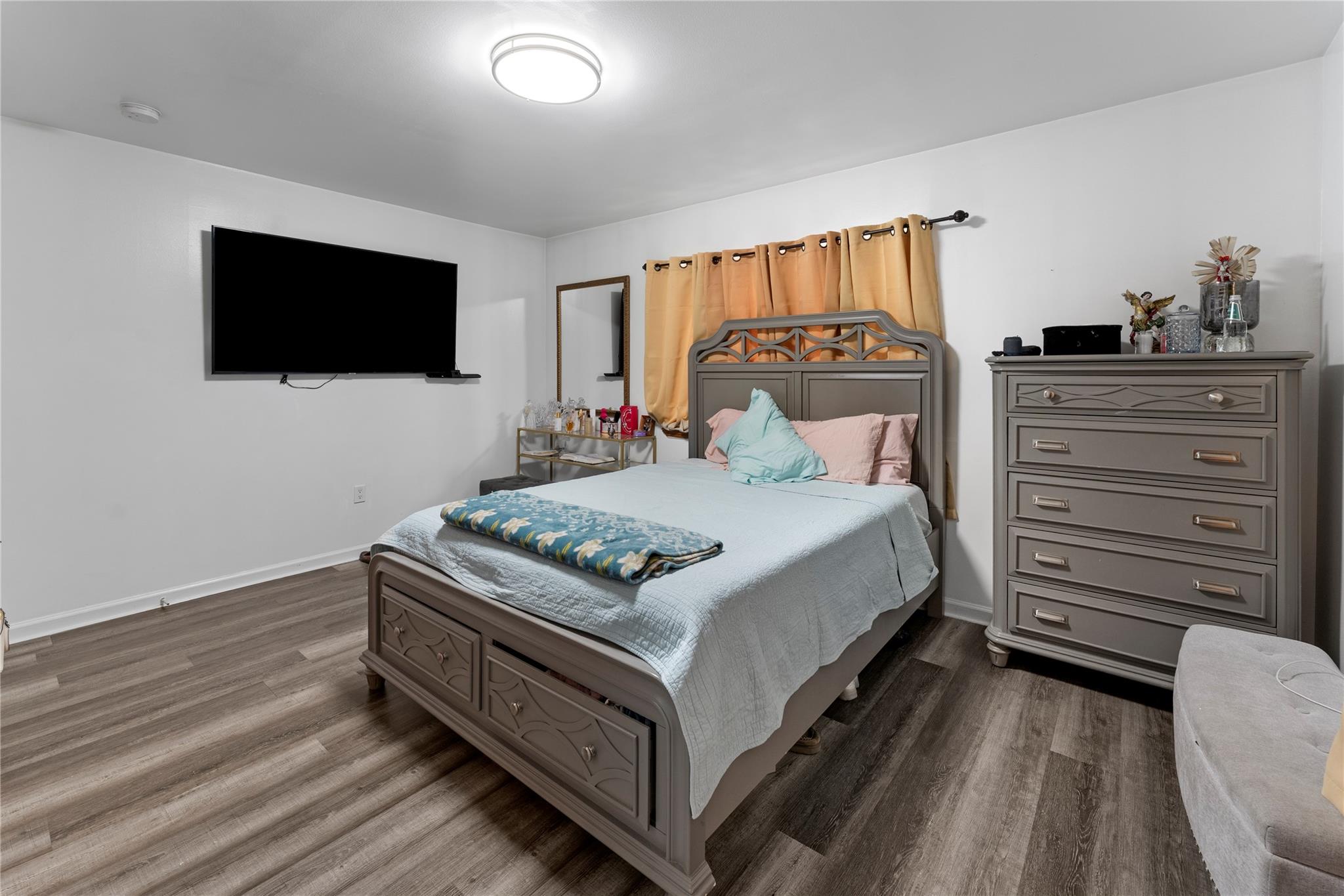 848 Morris Park Avenue Bronx, NY 10462 - Photo 17 of 22 a bedroom with a bed and a flat screen tv