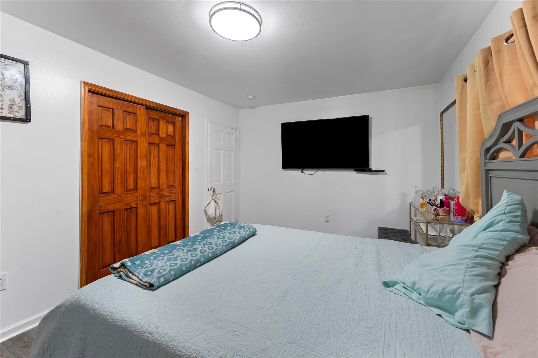 848 Morris Park Avenue Bronx, NY 10462 - Photo 18 of 22 a bedroom with a bed and a flat screen tv