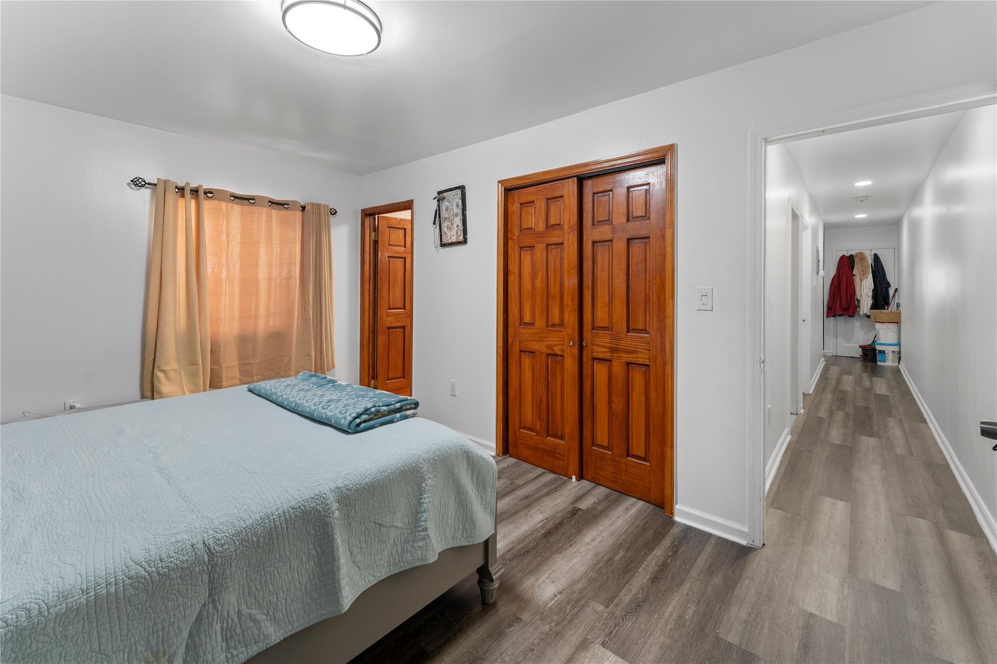 848 Morris Park Avenue Bronx, NY 10462 - Photo 21 of 22 a bedroom with a bed and a dresser