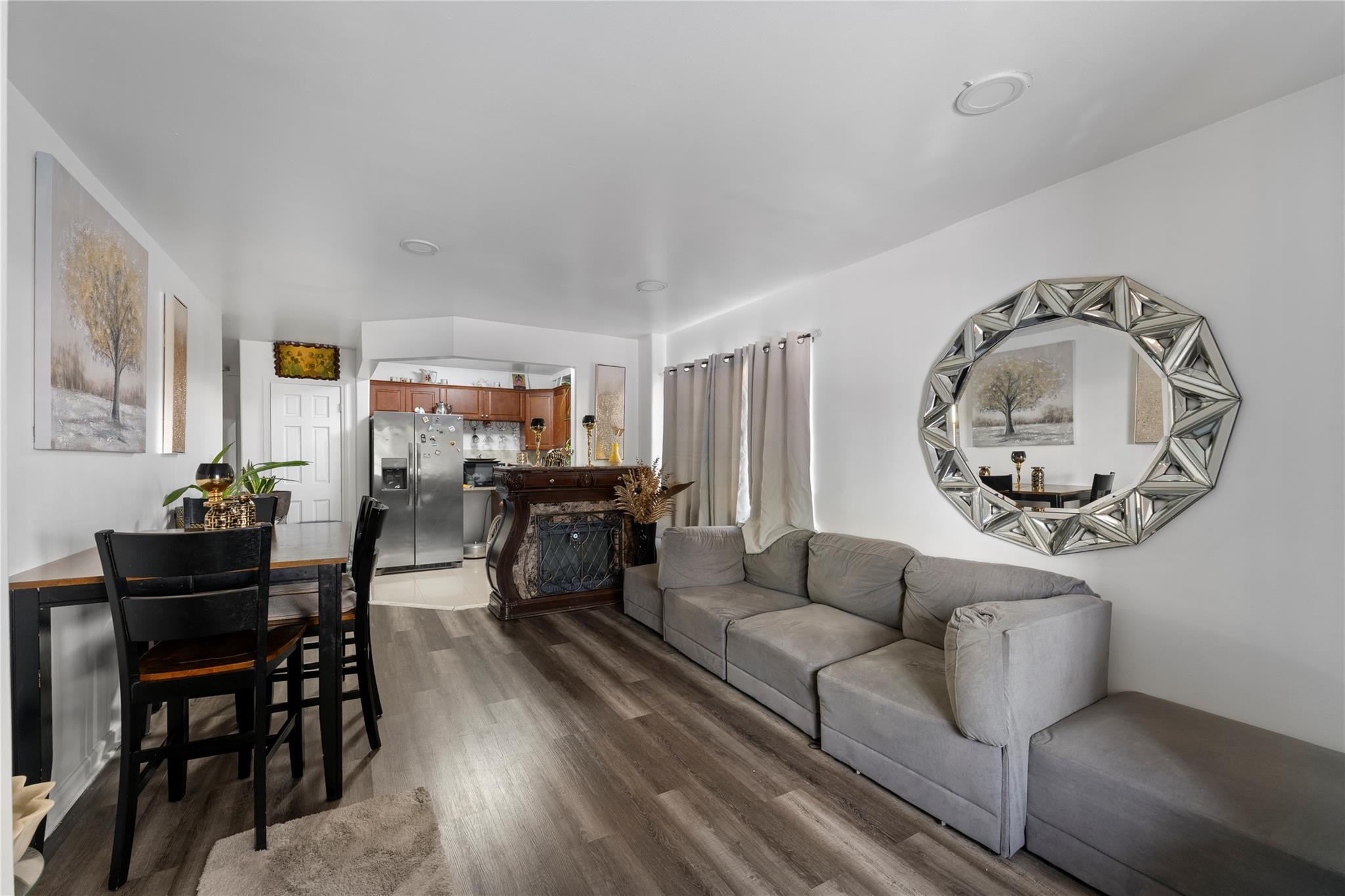 848 Morris Park Avenue Bronx, NY 10462 - Photo 3 of 22 a living room with furniture a dining table and a bookshelf