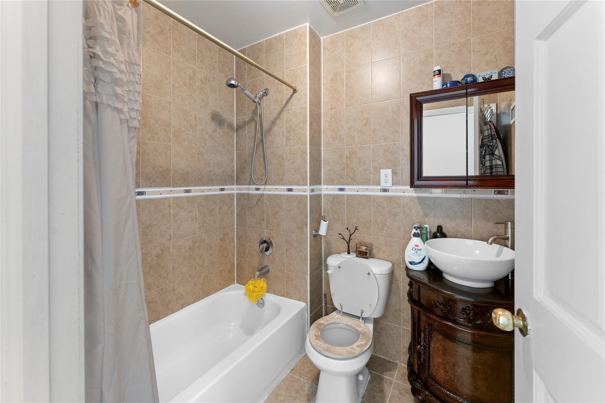 848 Morris Park Avenue Bronx, NY 10462 - Photo 8 of 22 a bathroom with a sink toilet and shower