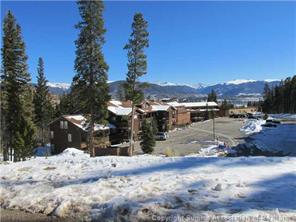 a view of a road with a snow in the background
