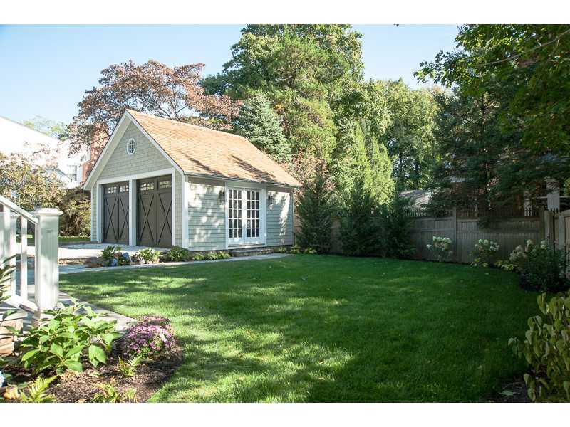 226 Riverside Avenue Riverside, CT 06878 - Photo 20 of 24 a front view of a house with a yard