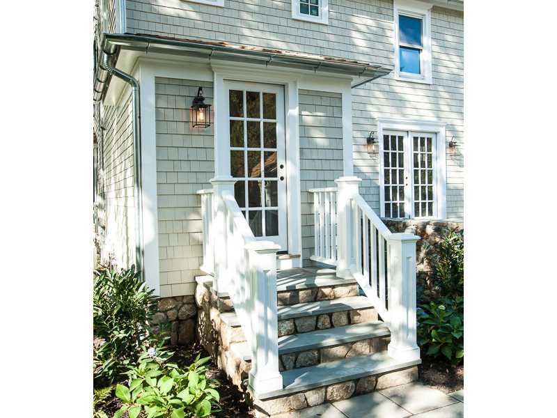 226 Riverside Avenue Riverside, CT 06878 - Photo 21 of 24 a front view of a house with wooden walls