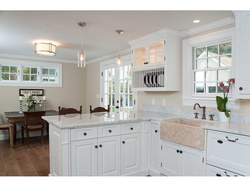 226 Riverside Avenue Riverside, CT 06878 - Photo 8 of 24 a kitchen with a sink cabinets and window