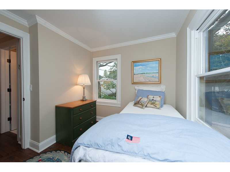 226 Riverside Avenue Riverside, CT 06878 - Photo 10 of 24 a bedroom with a bed and a large window