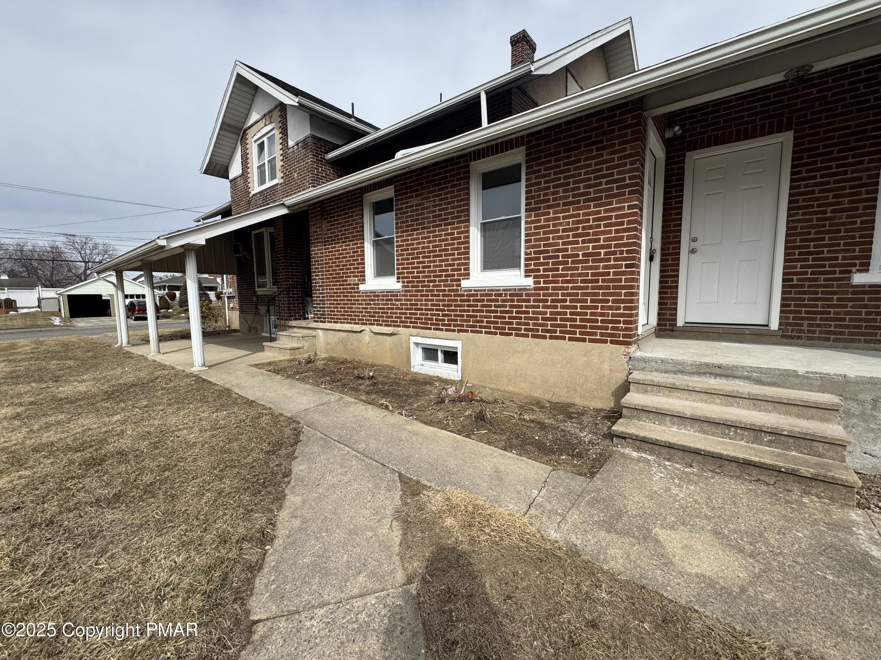 807 Chestnut Street, Unit 2 Coplay, PA 18037 - Photo 1 of 13 a front view of a house with a garage