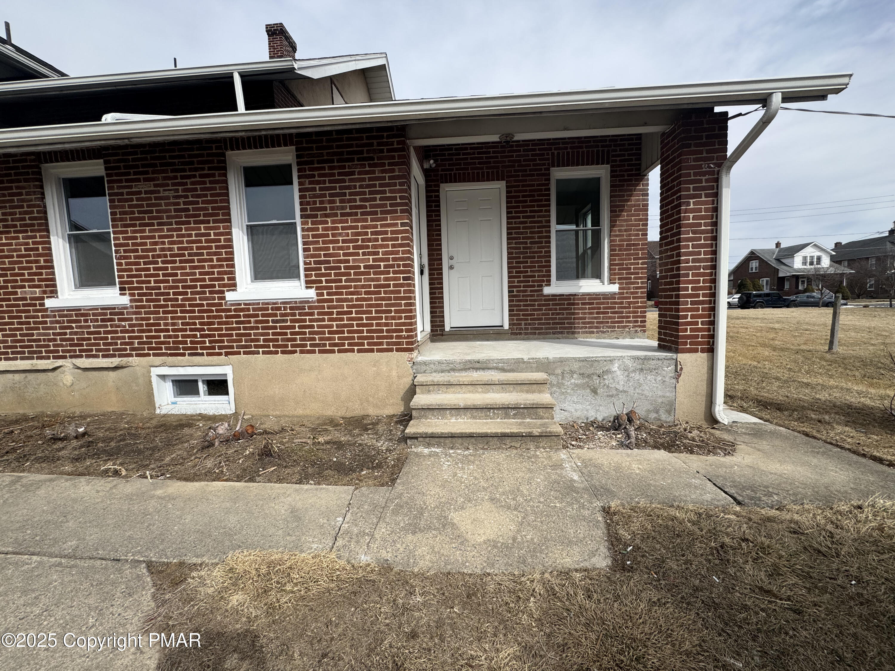 807 Chestnut Street, Unit 2 Coplay, PA 18037 - Photo 3 of 13 a front view of a house with a yard