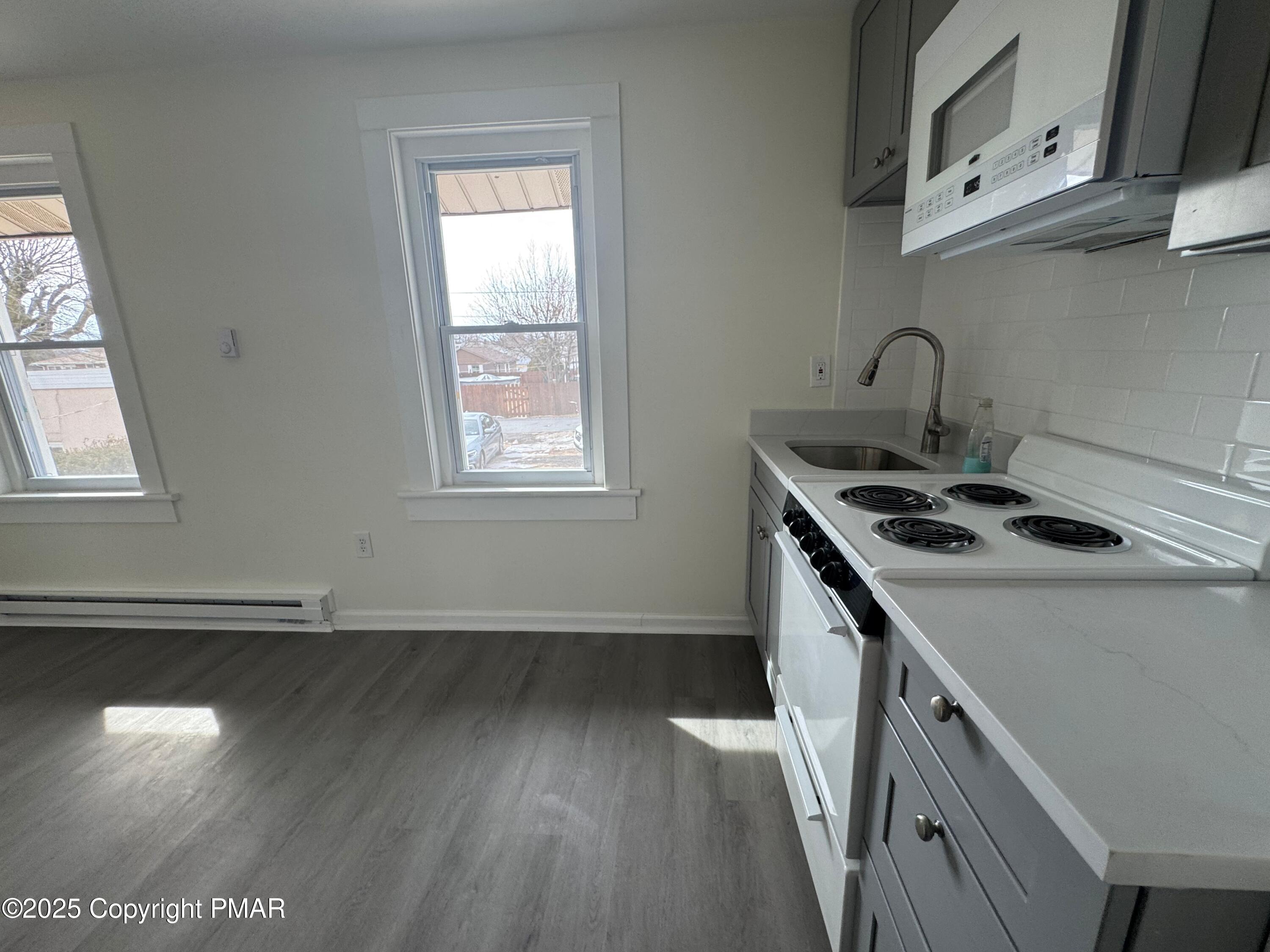 807 Chestnut Street, Unit 2 Coplay, PA 18037 - Photo 7 of 13 a kitchen that has a sink and a stove