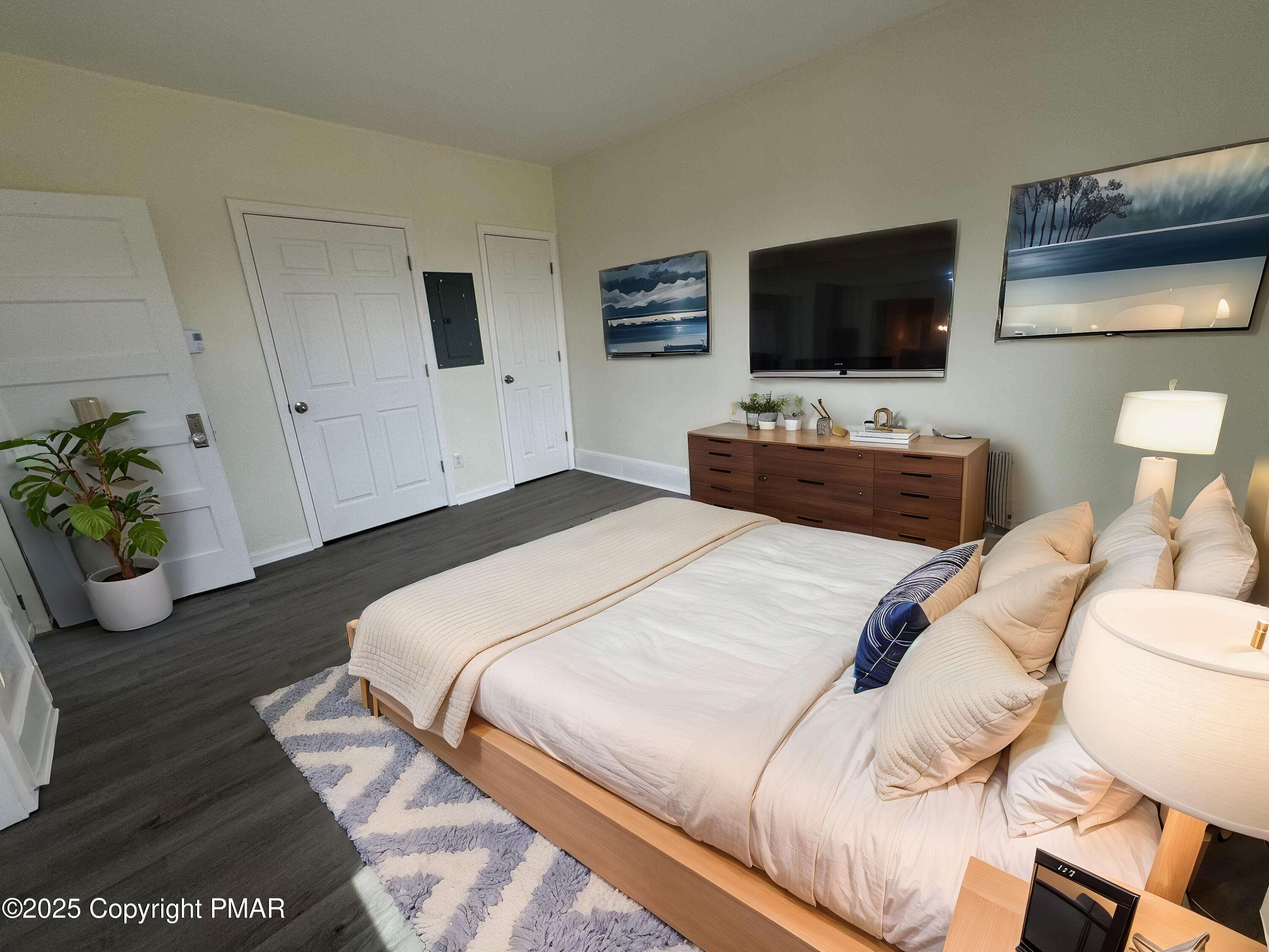 807 Chestnut Street, Unit 2 Coplay, PA 18037 - Photo 10 of 13 a bedroom with a bed and a flat screen tv