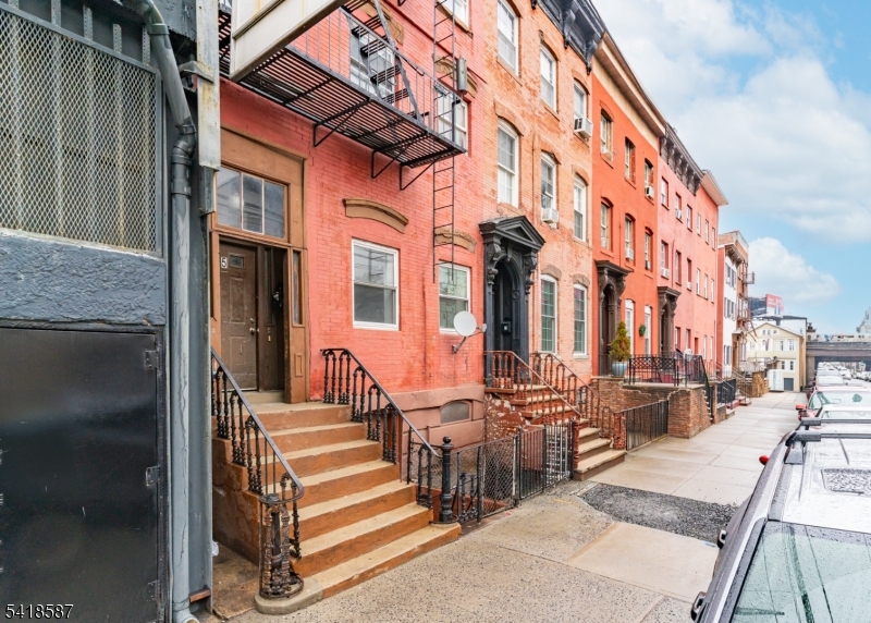 a view of a brick building with many windows