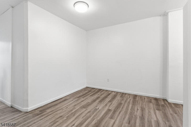 5 Elm Street, Unit 3 Newark, NJ 07102 - Photo 3 of 15 a view of a room with wooden floor