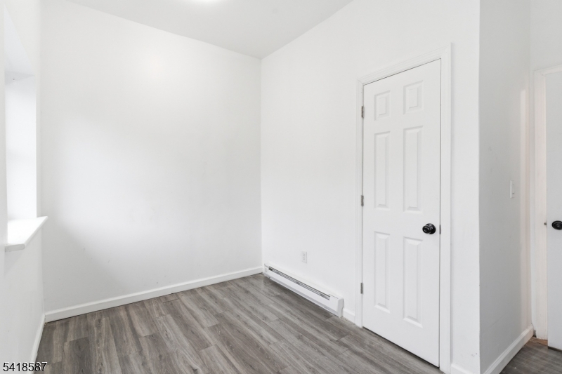 5 Elm Street, Unit 3 Newark, NJ 07102 - Photo 10 of 15 a view of an empty room with wooden floor