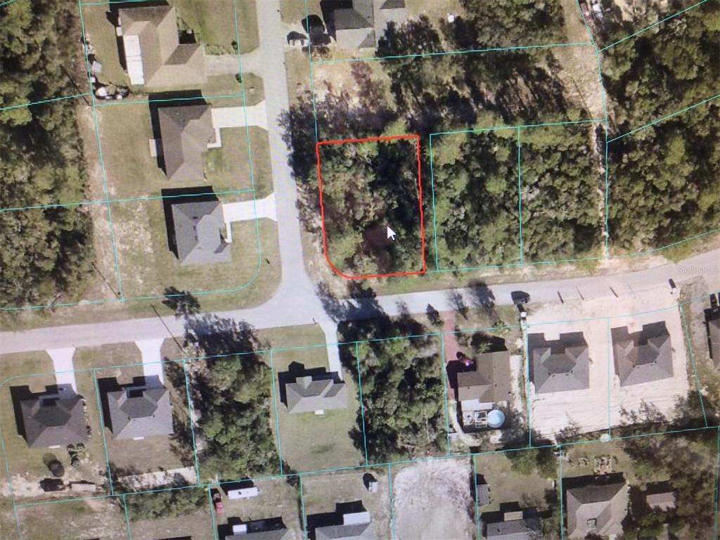 0 Southwest 151st Place Ocala, FL 34473 - Photo 4 of 4 an aerial view of multiple houses with outdoor space