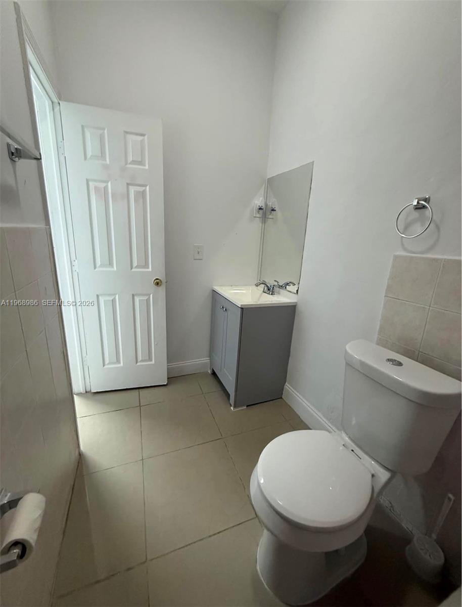 23160 Southwest 113 Passage, Unit 2 Miami, FL 33170 - Photo 12 of 12 a bathroom with a toilet and a sink