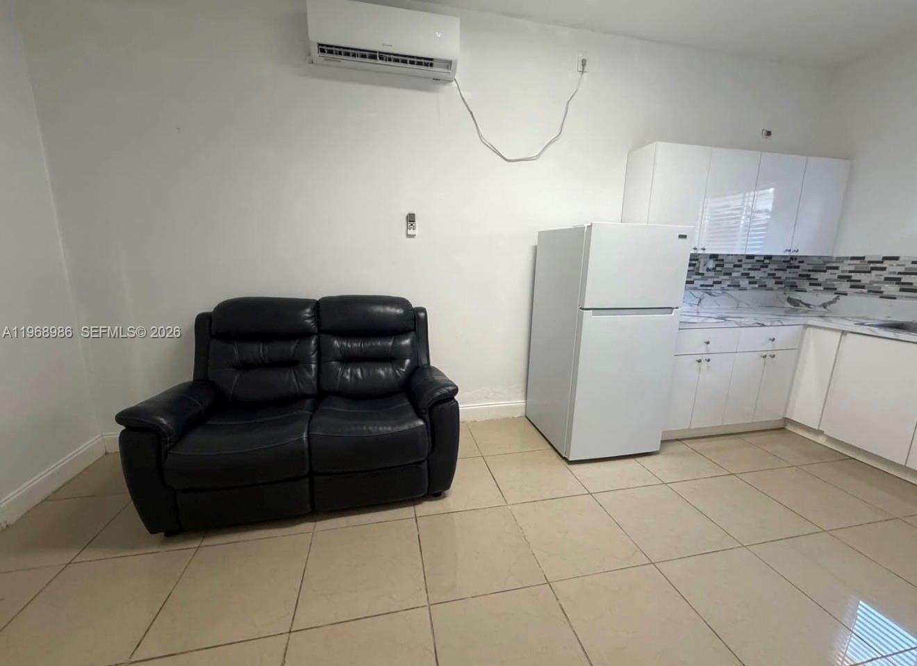 23160 Southwest 113 Passage, Unit 2 Miami, FL 33170 - Photo 2 of 12 a living room with a couch