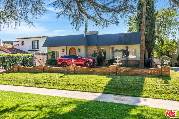 a view of a house with a yard patio and a patio